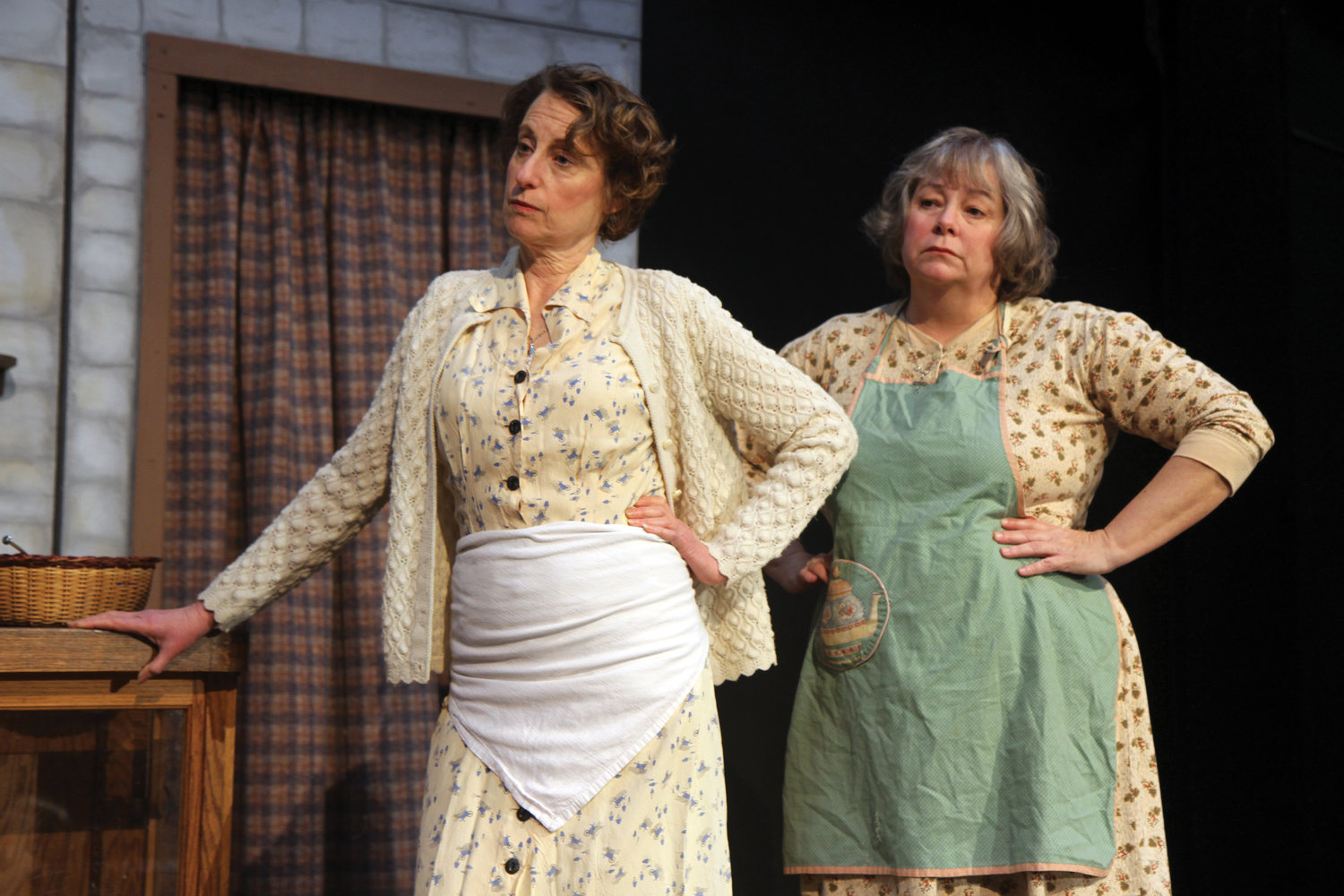 Michelle Hensel, as Auntie Kate, left, and, Jennifer Nielsen, as Auntie Eileen, give their best motherly scowls during a recent dress rehearsal.